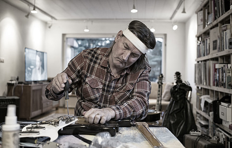 man holding screw driver thumbnail