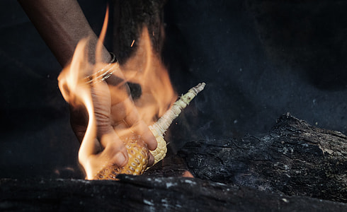 person burning corn thumbnail
