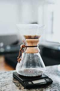 clear glass flask on black digital pocket scale thumbnail