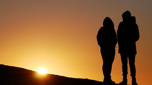 couple on hill during sunset thumbnail