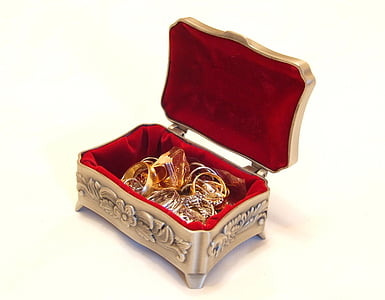 gold-colored rings in steel jewelry box thumbnail