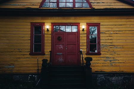 brown wooden closed door near window pane at daytime thumbnail