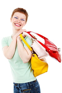 woman holding three assorted-color handbags thumbnail