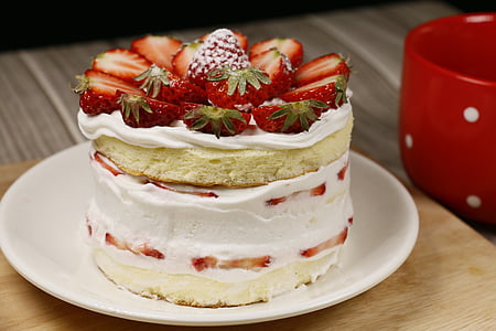 round strawberry cake beside mug thumbnail