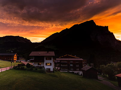 white concrete house in front of mountain thumbnail