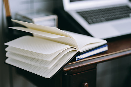 Elegant workspace with Macbook, iPhone, business cards and notebooks thumbnail