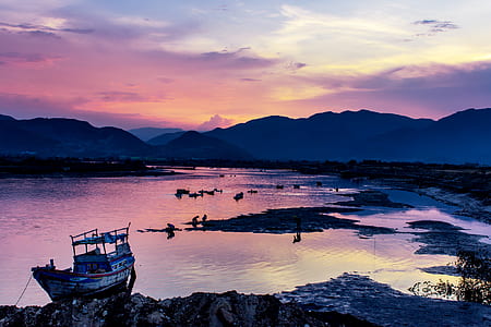 boat on body of water during golden hour thumbnail