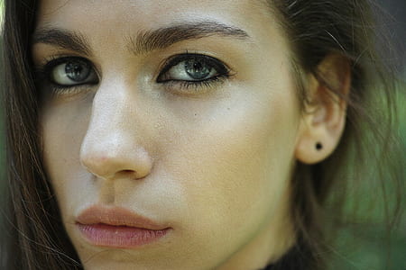 shallow focus photography of woman's face thumbnail