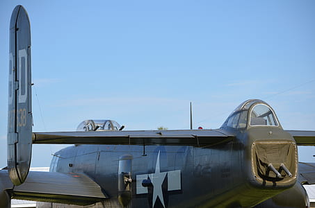 close-up photography of plane under blue sky thumbnail