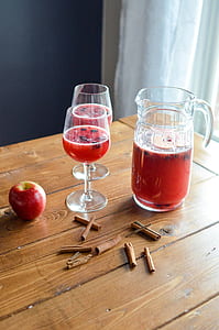 two clear wine glass beside clear glass pitcher thumbnail