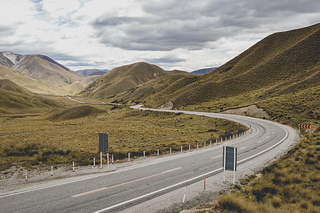 road beside mountain thumbnail