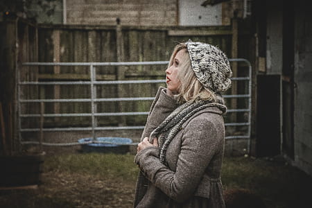 Woman Wearing Gray Hoodie and Knit Cap thumbnail