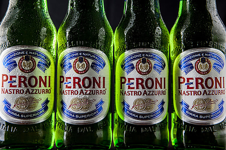 Close-up shot of green Peroni lager beer bottles thumbnail