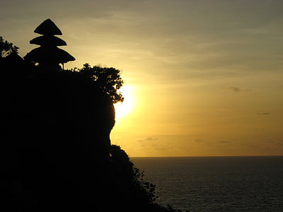 silhouette photo of mountain cliff and tree thumbnail