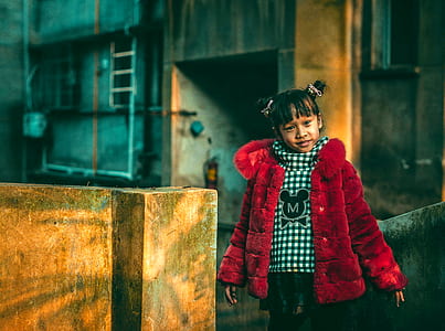 girl standing near block thumbnail