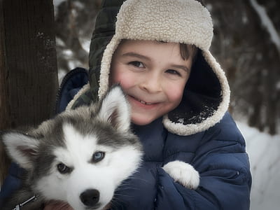 person wearing blue and black snow coat thumbnail
