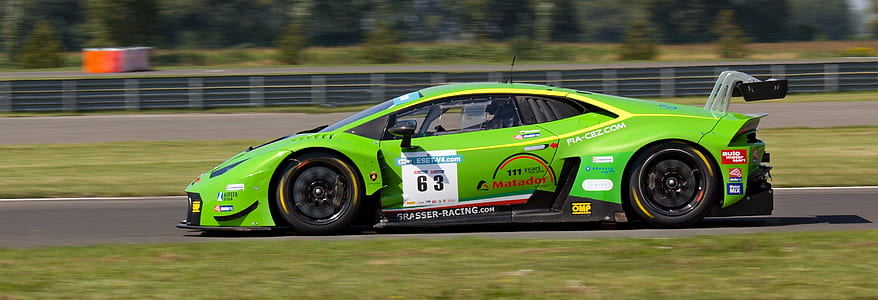 Green Sports Car on Gray Asphalt Road thumbnail