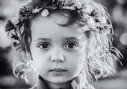 Photo Gray Scale of a Child With Floral Tiara thumbnail