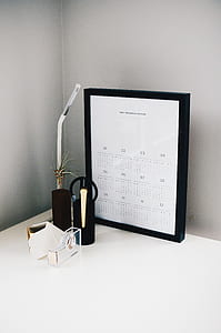 white calendar on table beside lamp thumbnail