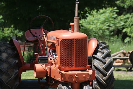 orange tractor in shallow focus lens thumbnail