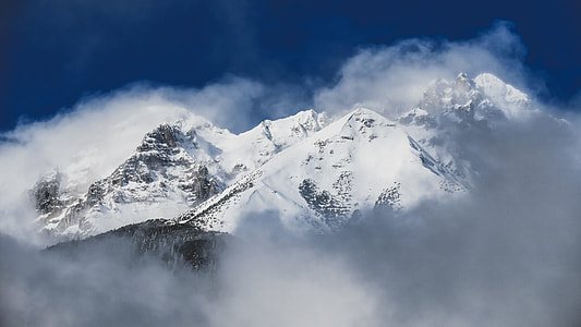 landscape photo of mountain summit covered with snow during daytime thumbnail