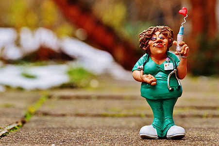 shallow focus photography of nurse figurine thumbnail