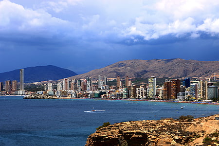 bird's-eye view photography of buildings near body of water thumbnail