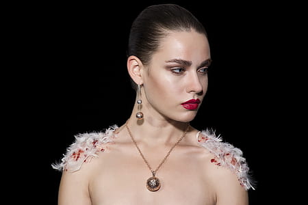 woman wearing necklace looking to the left thumbnail