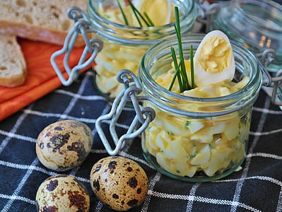 three quail eggs beside mason jars thumbnail