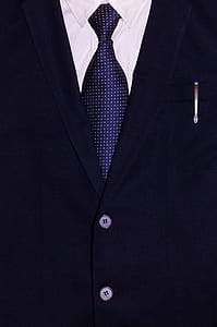 person wearing black blazer with white shirt outfit in close-up photography thumbnail