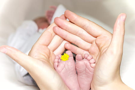 person holding baby's feet thumbnail