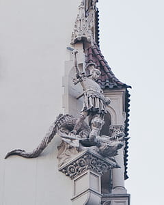 Knight Standing on Dragon Statue thumbnail
