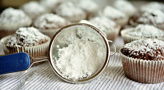 selective focus photography of white powder on white textile thumbnail