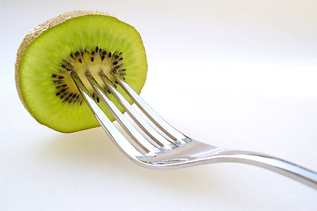 stainless steel fork with sliced kiwi fruit thumbnail