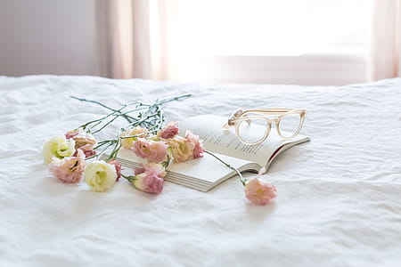 Pink Yellow Flowers On Bed Photo thumbnail