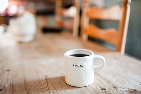 white ceramic mug on brown wooden tabletop thumbnail