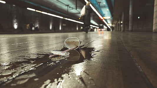 clear plastic disposable cup on floor thumbnail