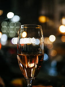 bokeh photography of wine glass with liquid thumbnail