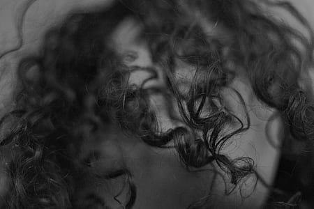 grayscale photography of curly hair thumbnail