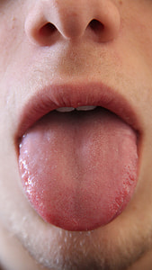 close up photo of a person's tongue thumbnail