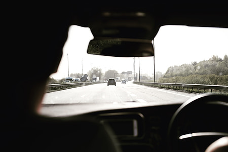 man riding his car during daytime thumbnail