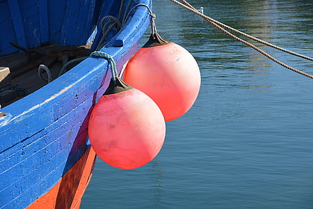 two round orange metal balls thumbnail