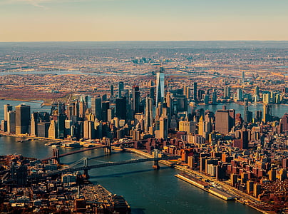 aerial view of buildings near body of water thumbnail