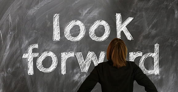girl standing infront of look forward chalk text thumbnail