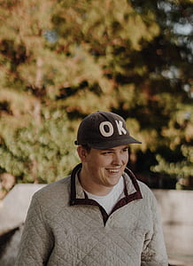 selective focus photography of man smiling thumbnail