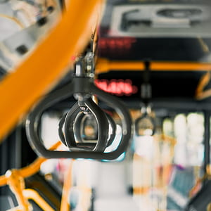selective focus photography of train passenger handle thumbnail