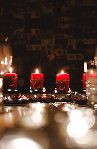 depth photography of red candles in rack thumbnail