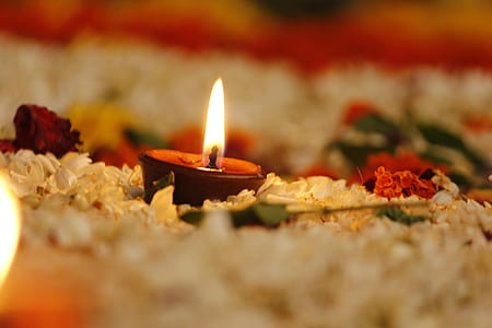 selective focus photography of lighted red votive candle thumbnail