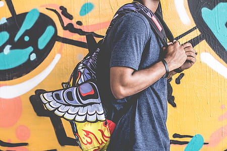 man wearing backpack thumbnail