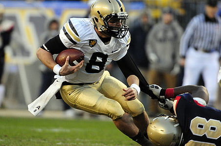 football player holding ball thumbnail